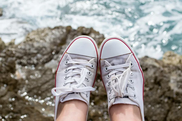 Sneakers at sea — Stock Photo, Image