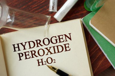 Words hydrogen peroxide written on a page. Chemistry concept. clipart