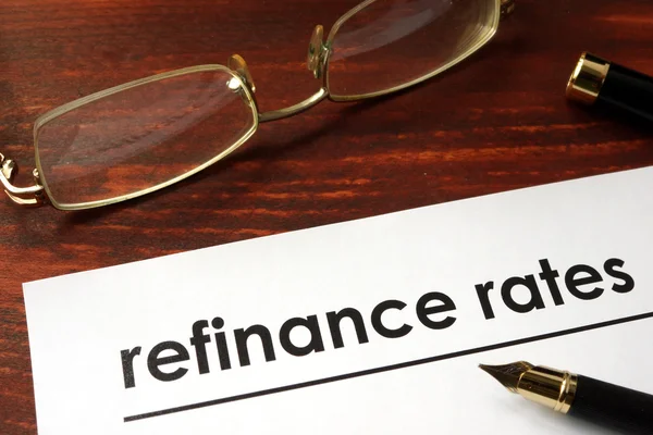 Paper with words refinance rates. — Stock Photo, Image