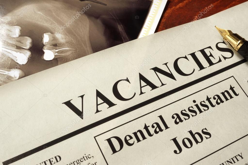 Newspaper with ads dental assistant jobs vacancy. — Stock Photo