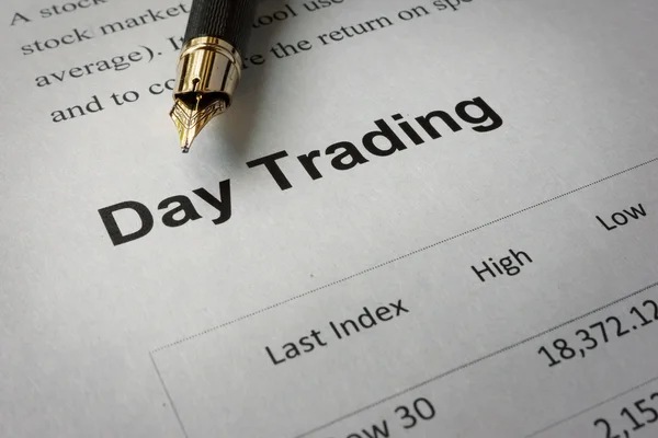 Page of newspaper with words day trading.