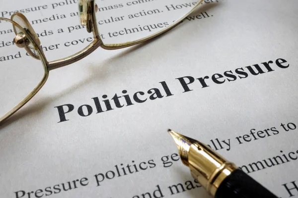 Page of paper with words Political Pressure and glasses. — Stock Photo, Image