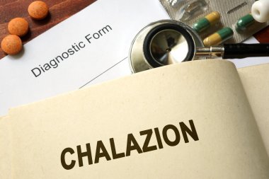 Page with word Chalazion and glasses. Medical concept. clipart
