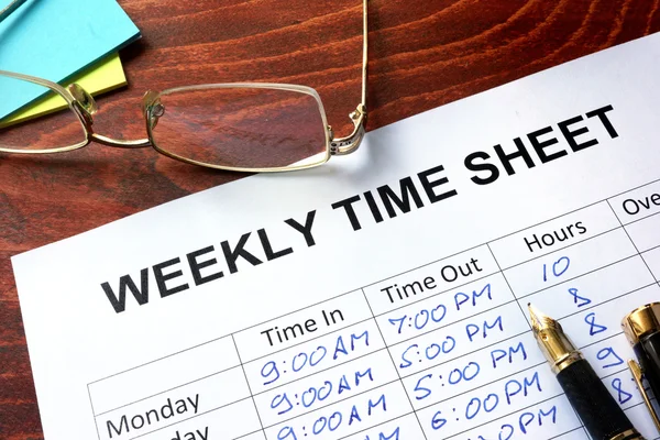 Paper with weekly time sheet on a table. — Stock Photo, Image