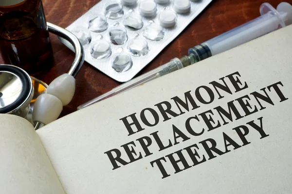 Book with words hormone replacement therapy on a table. — Stock Photo, Image