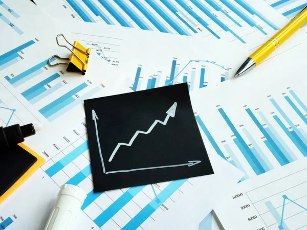 Rising arrow and charts. Business success and favorable business outlook. Profit increase concept. — Stock Photo, Image