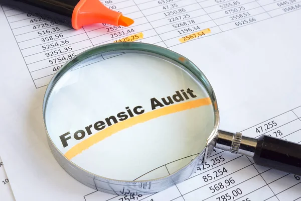 Forensic audit data and magnifying glass on papers. — Stock Photo, Image