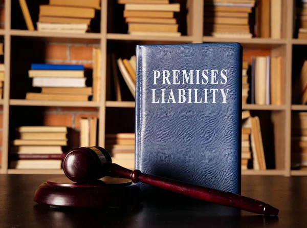 Premises Liability book with a court hummer. — Stock Photo, Image