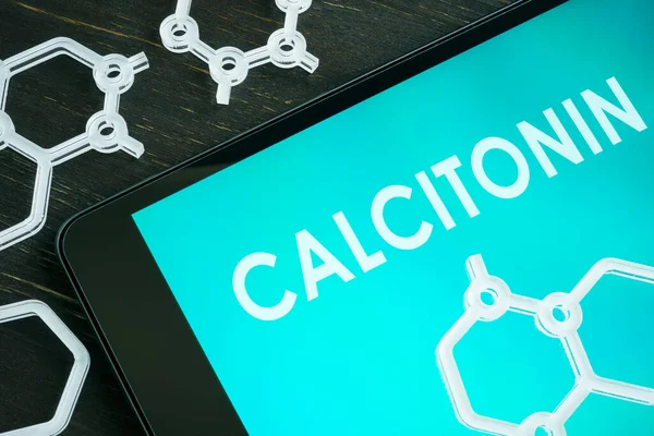 Calcitonin hormone on the notepad screen and chemical symbols. — Fotografia de Stock