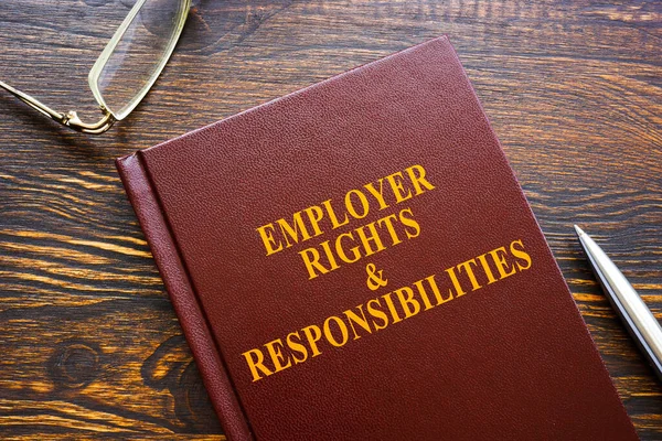 Employer Rights and Responsibilities book and glasses. — Stock Photo, Image