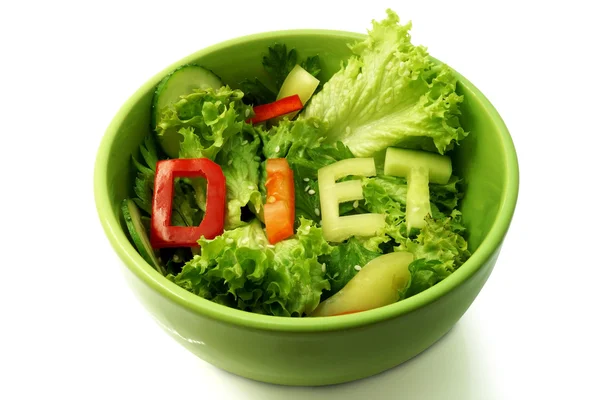 Green plate with word diet composed of slices of different vegetables on salad — Stock Photo, Image