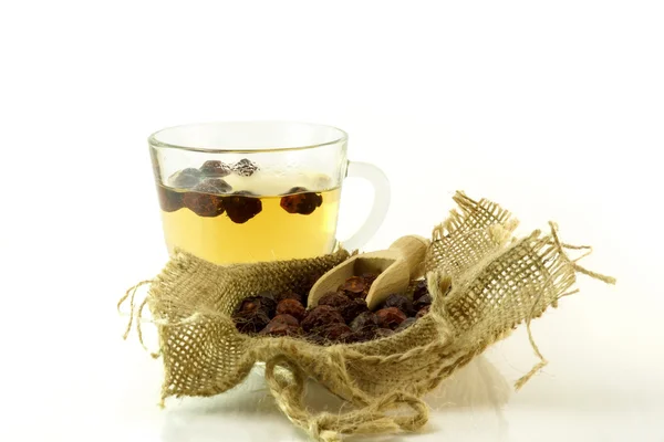 Cup of herbal tea with  rose hip  on a white background — Stock Photo, Image