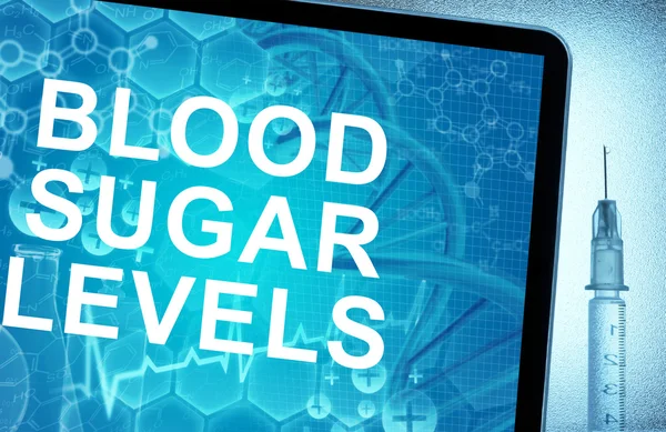 As palavras Níveis de açúcar no sangue num comprimido com seringa — Fotografia de Stock