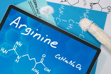 Arginin kimyasal formülü ile tablet.