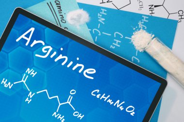 Tablet with the chemical formula of  Arginine. clipart
