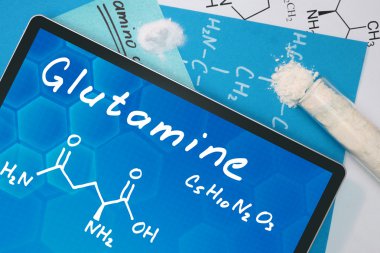 Tablet with the chemical formula of  Glutamine. clipart