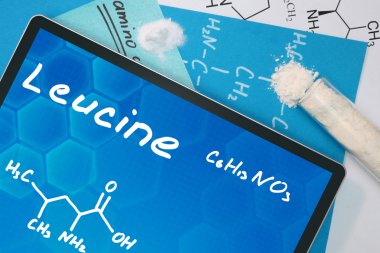 Tablet with the chemical formula of  Leucine. clipart