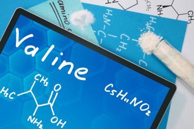 Valin kimyasal formülü ile tablet.