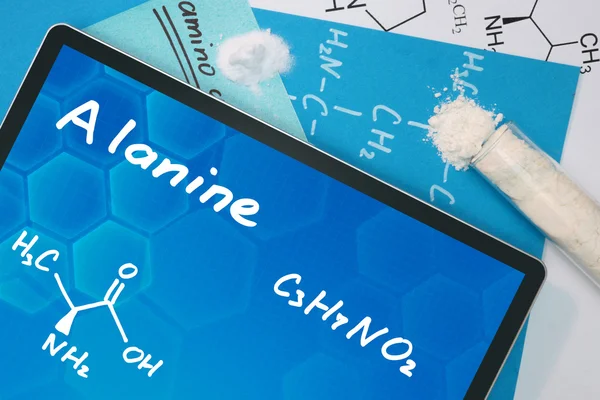 Tablett med den kemiska formeln av alanin. — Stockfoto