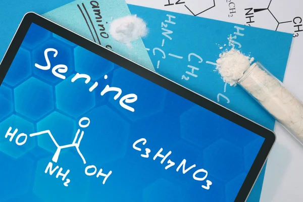 Tablett med den kemiska formeln av serin. — Stockfoto