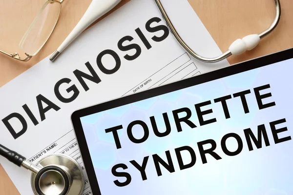 Tablette mit Diagnose Tourette-Syndrom und Stethoskop. — Stockfoto