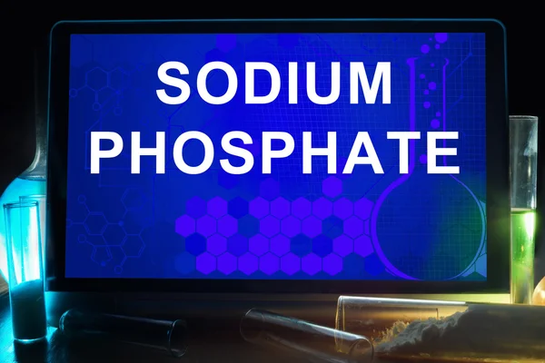 Tablet with chemical formula of  Sodium phosphate. — Stock Photo, Image