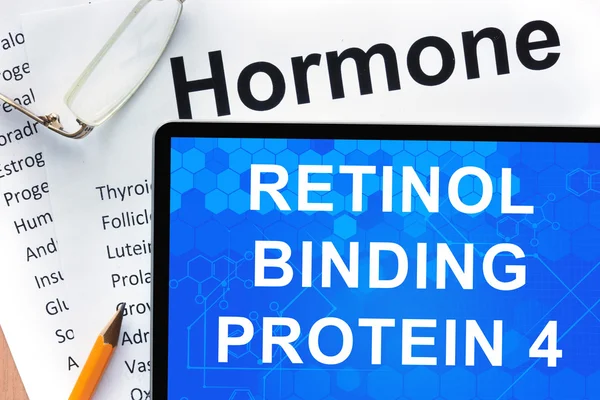 Papers with hormones list and tablet  with words  retinol binding protein 4 (RBP4). — Stock Photo, Image