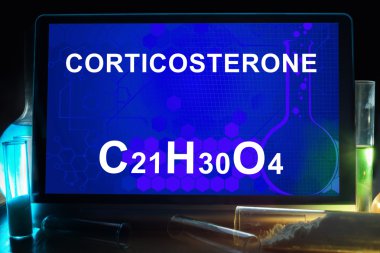 Tablet with chemical formula of corticosterone . clipart