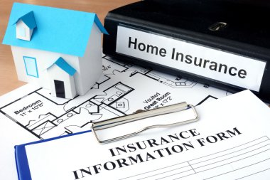 Model of house and folder with home insurance. clipart