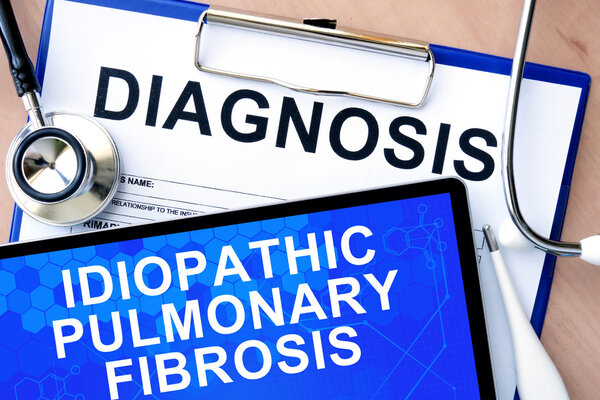 Form with diagnosis and tablet with Idiopathic pulmonary fibrosis