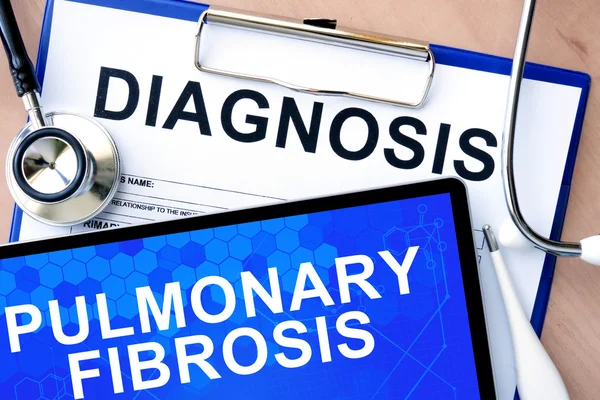 Form with diagnosis and tablet with pulmonary fibrosis — Stock Photo, Image