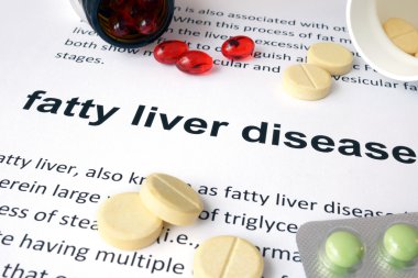 Paper with fatty liver disease  and pills. clipart