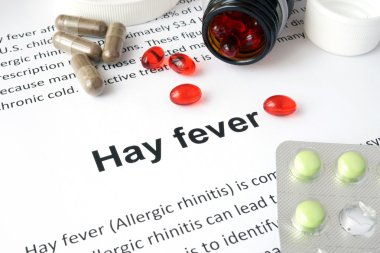 Paper with Hay fever  and pills. clipart