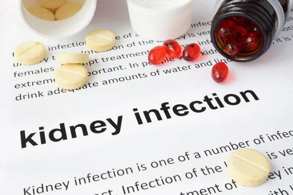 Paper with kidney infection  and pills. — Stock Photo, Image