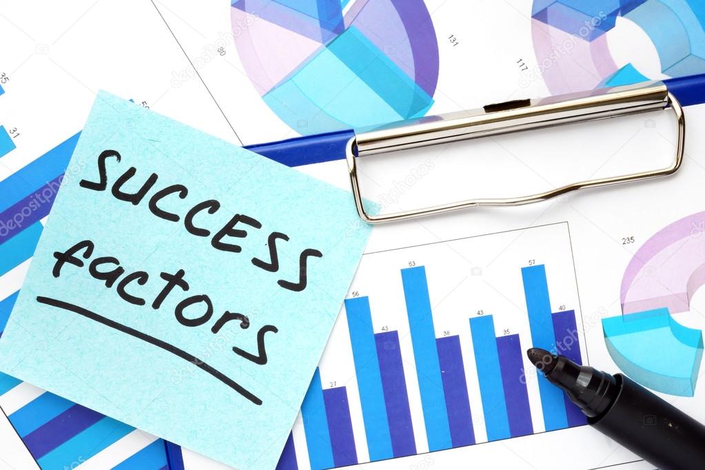 Paper with words success factors and graphs.