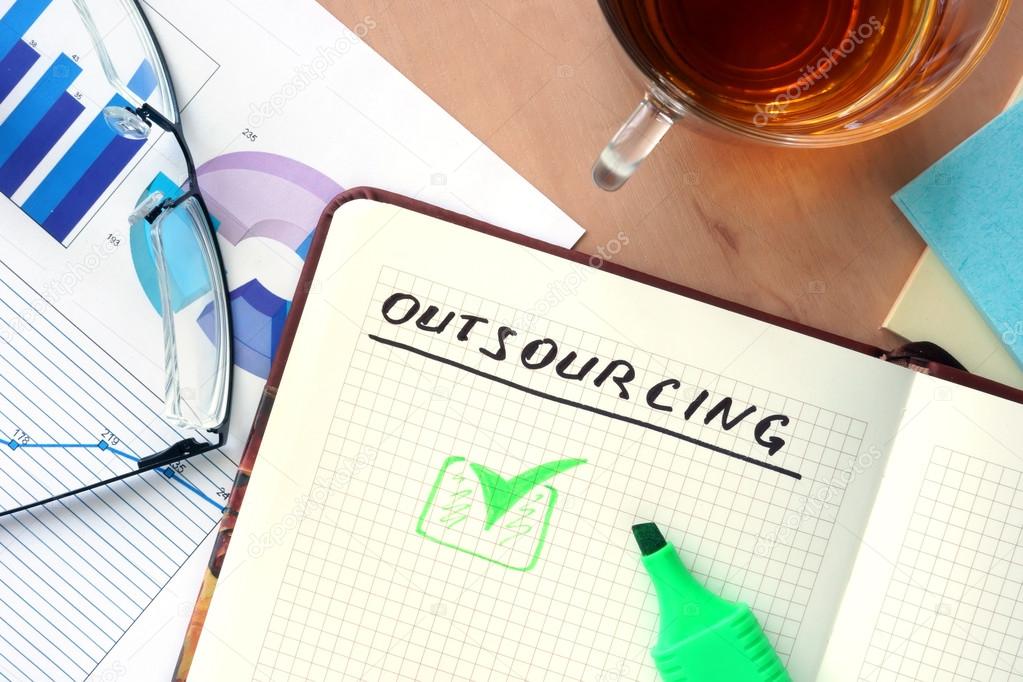 Notepad with word outsourcing concept