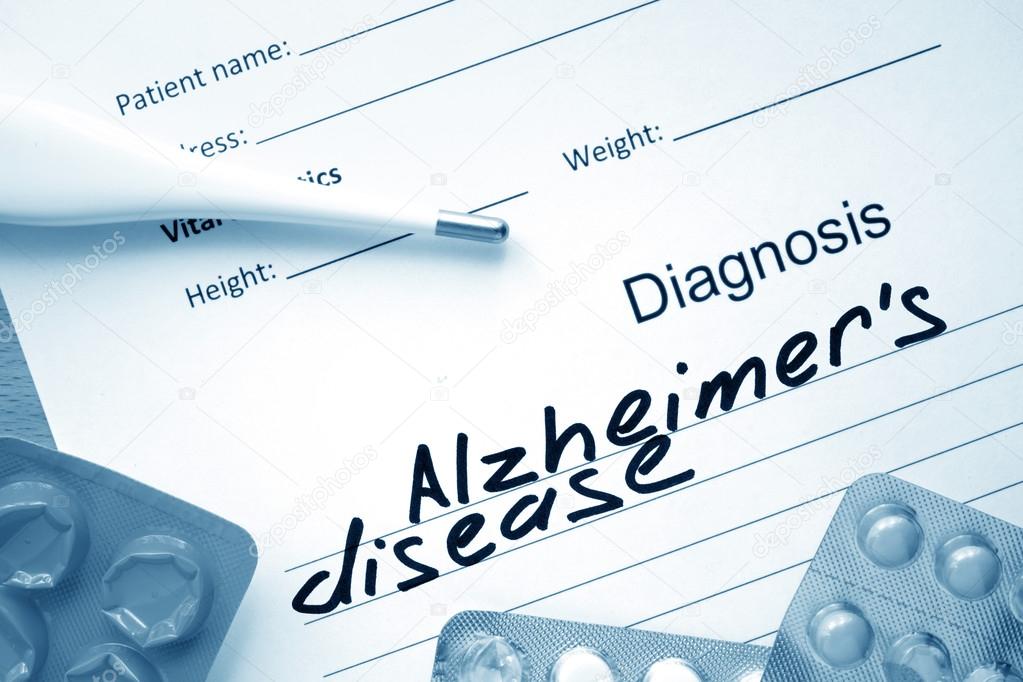 Diagnostic form with diagnosis Alzheimers disease and pills.