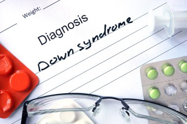 Diagnosis Down syndrome and tablets.
