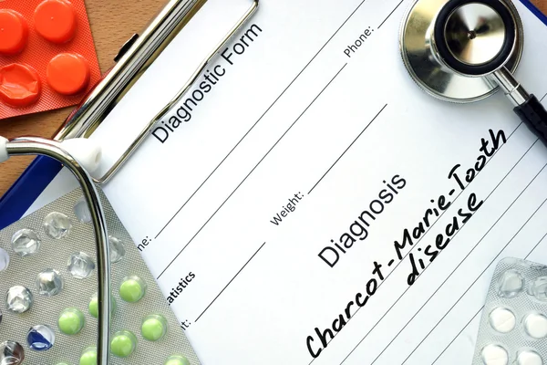 Diagnosis Charcot-Marie-Tooth disease and tablets. — Stockfoto