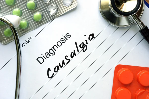 Diagnosis Causalgia and tablets. — 图库照片