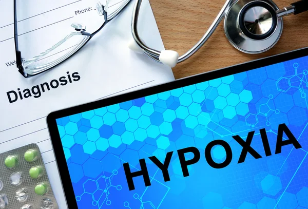 Diagnosis Hypoxia and tablets. — ストック写真