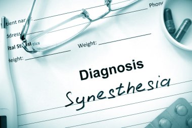 Diagnosis  Synesthesia, pills and stethoscope. clipart