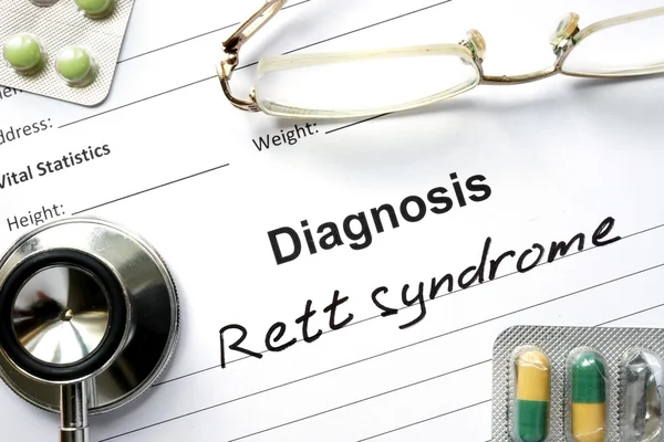 Diagnóstico Síndrome de Rett, pastillas y estetoscopio . —  Fotos de Stock