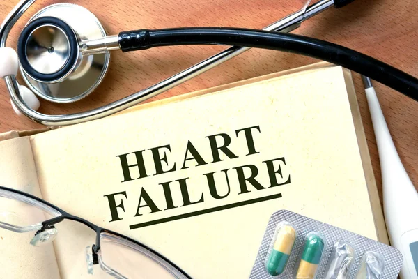 Heart failure concept. Book with stethoscope and pills. — Stock Photo, Image