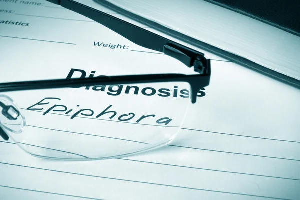 Diagnosis list with Epiphora and glasses. — Stock Photo, Image