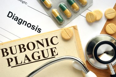 Word Bubonic plague  on a book and pills. clipart