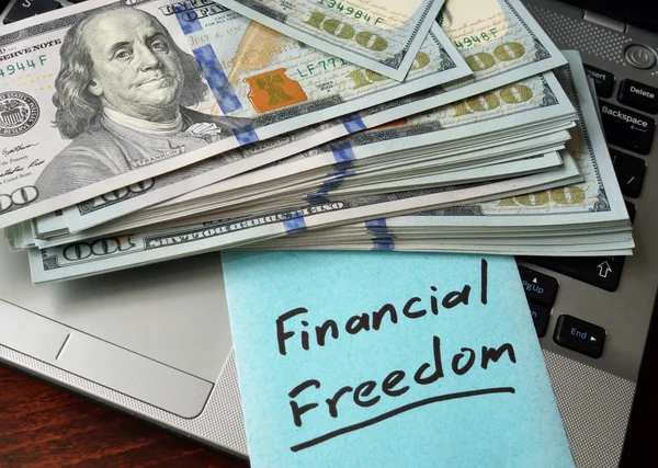 Financial Freedom  concept on a paper with notebook. — Stock Photo, Image