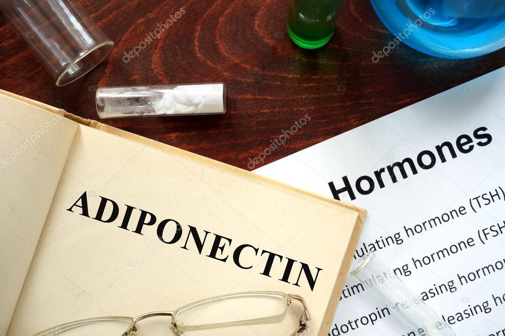 Hormone adiponectin written on book.