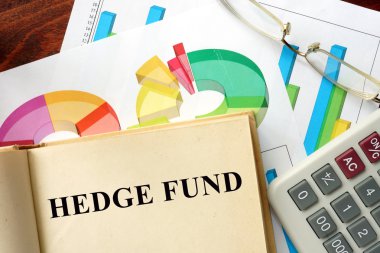 Words hedge fund written on a book. clipart