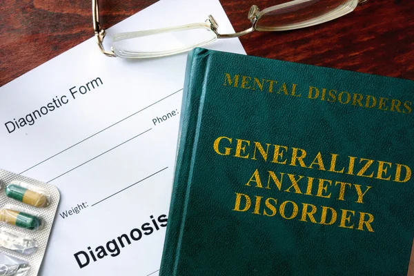 Generalized anxiety disorder concept. Diagnostic form and book on a table. — Stock Photo, Image